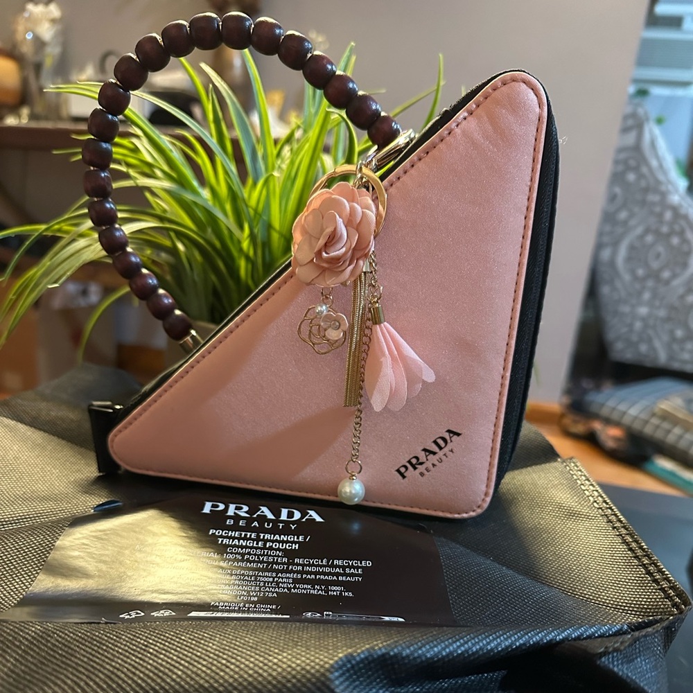 - Prada triangle beauty pouch with Handel and charm new.